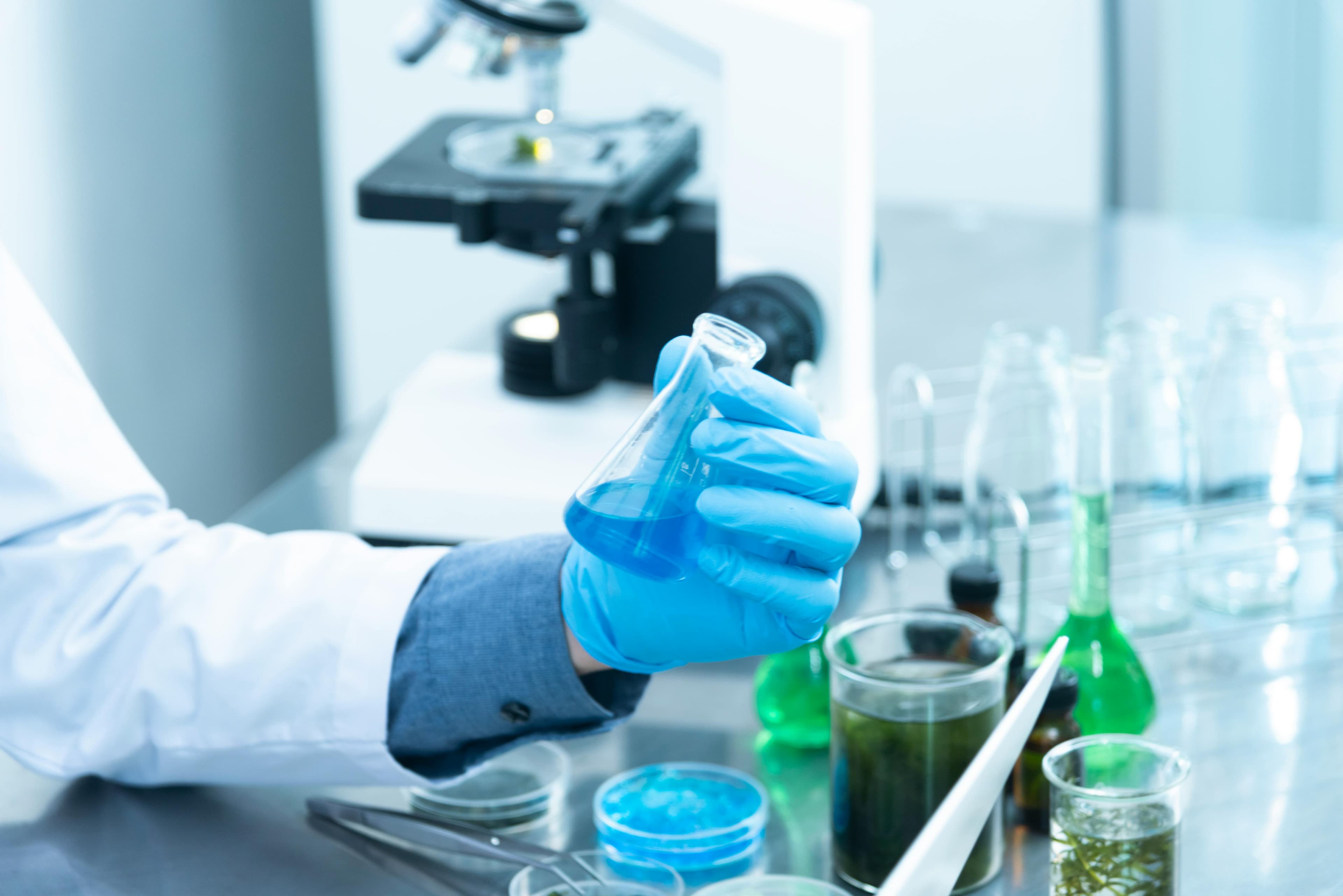 lab worker looking at sample